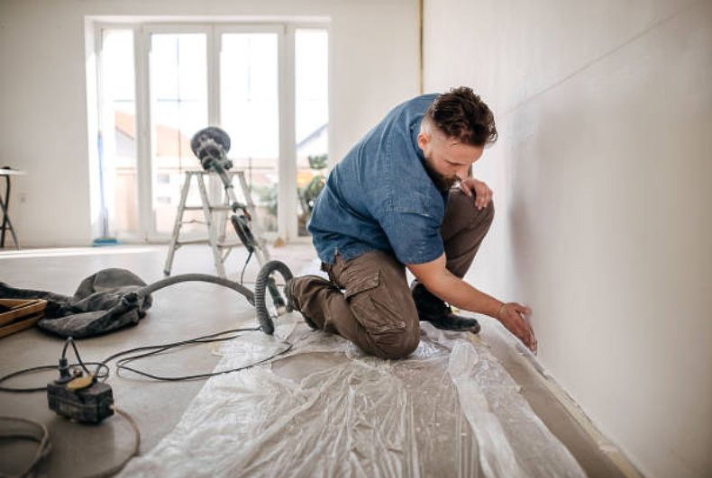 Pintura e acabamento de parede interna em obra residencial da Iluminic